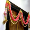 Pink Gajra Toran With Peacock Hangings.