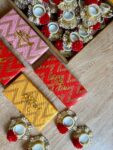 Stone  Diya Hamper with red Flower